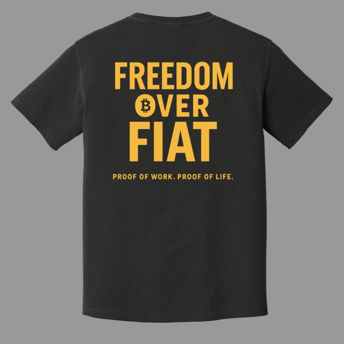 Black t-shirt with yellow text 'Freedom Over Fiat' and Bitcoin symbol on a white background