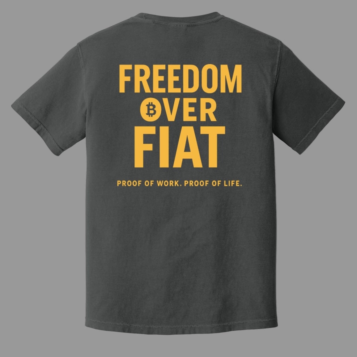 Black t-shirt with yellow text 'Freedom Over Fiat' on a white background