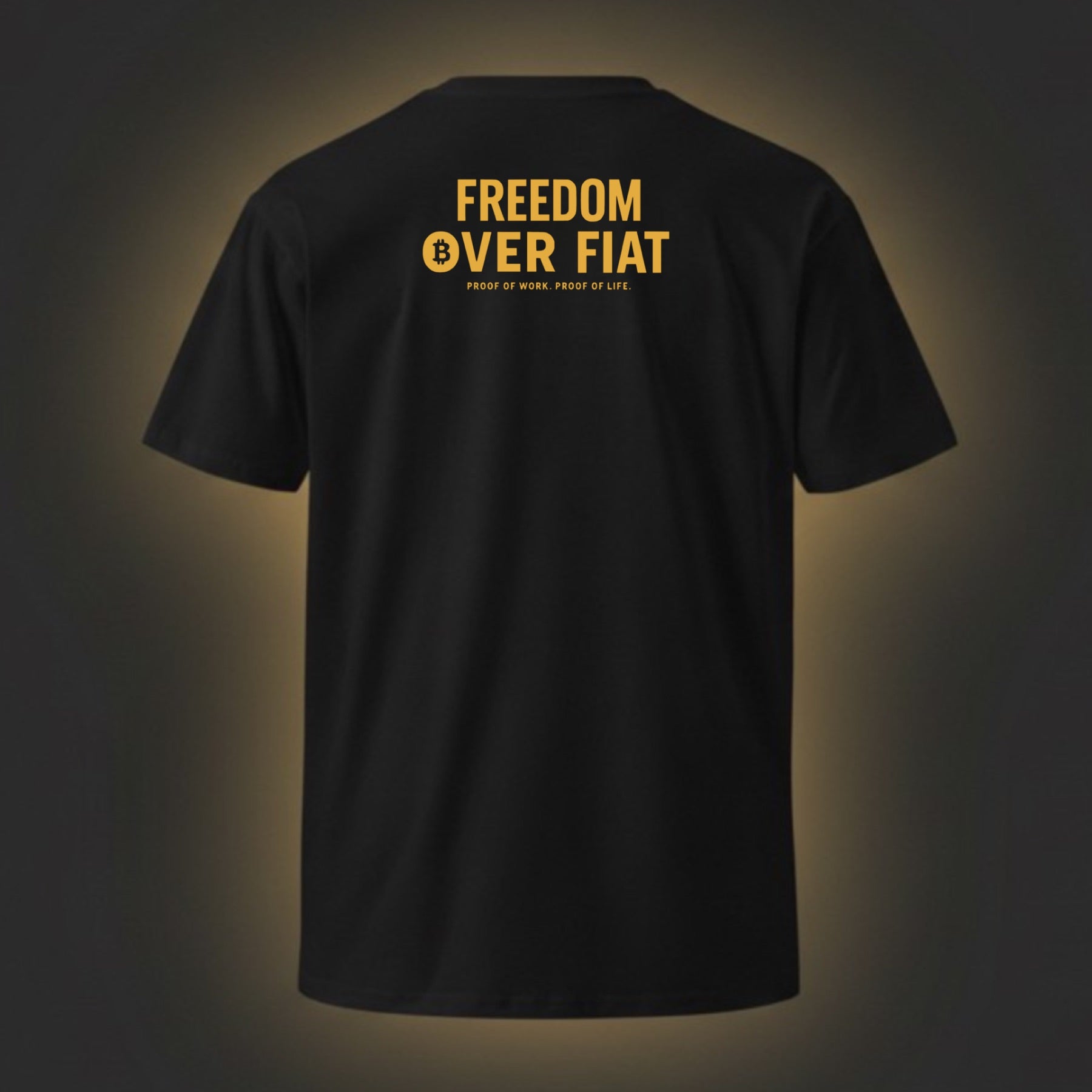 Black t-shirt with yellow text 'Freedom Over Fiat' on a dark background