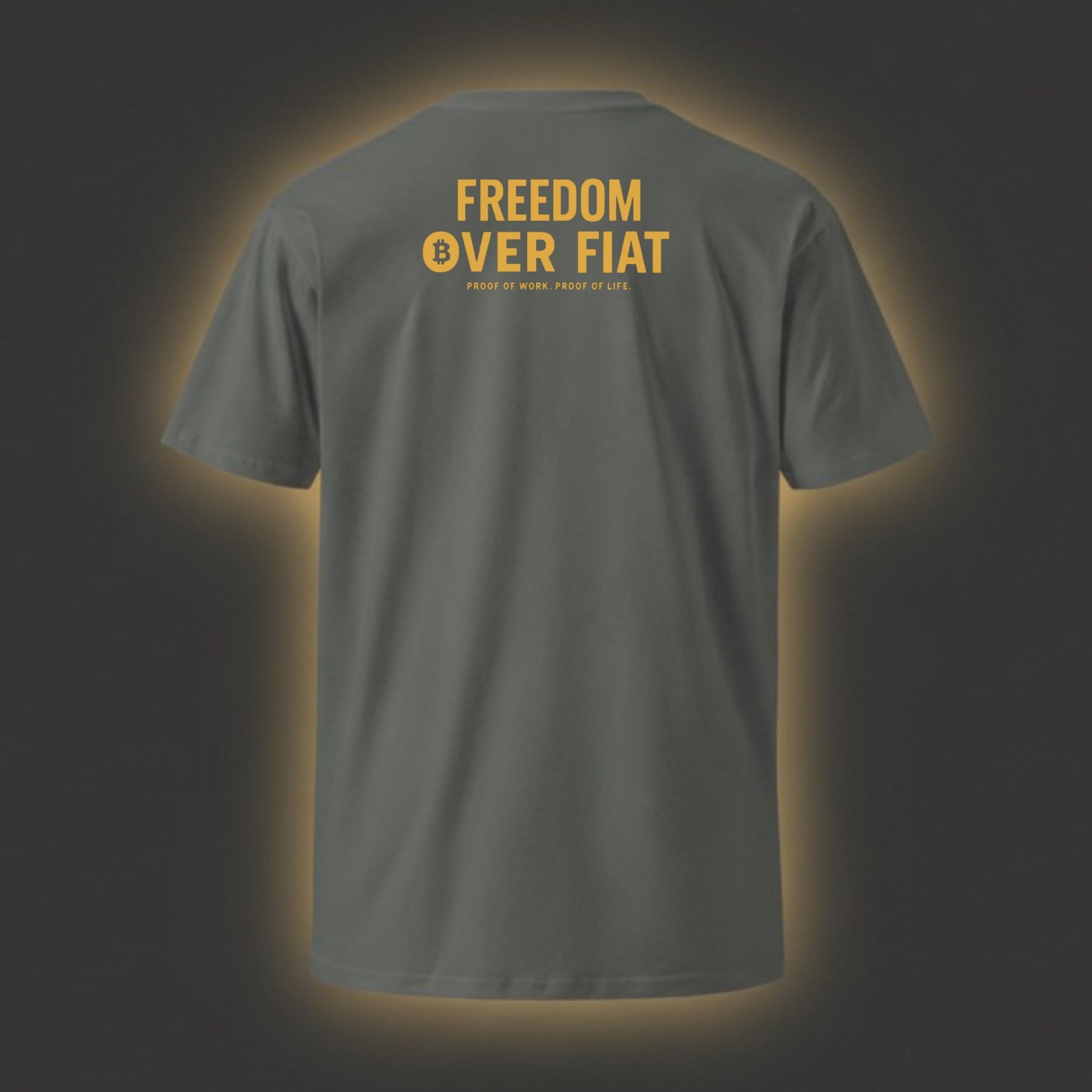 Gray t-shirt with 'Freedom Over Fiat' text on the back against a dark background